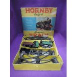 A Hornby tin plate and clockwork 0 gauge goods set comprising loco and tender 45746, two wagons