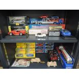 Two shelves of modern diecasts including Burago, Maisto, Shell, Corgi etc, most boxed