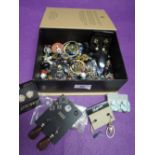 A box containing a selection of costume jewellery earrings