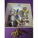 A small selection of costume jewellery brooches including porcelain, diamante, enamelled etc