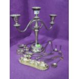 A silver plated candelabra and selection of silver plated flatware