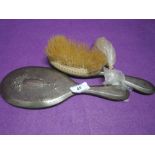 An HM silver dressing table brush and mirror having ribbon and swag decoration