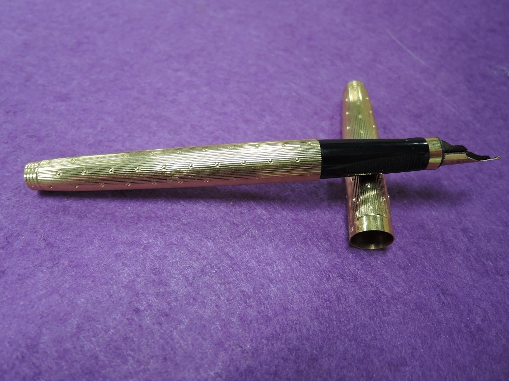 A rolled gold Parker cartridge fountain pen
