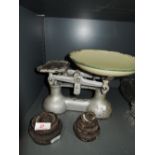 A set of vintage balance scales and weight set