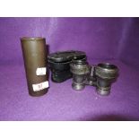 A set of vintage binoculars and piece of early trench art