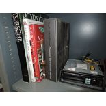 A selection of vintage car ephemera and Alpine car radio