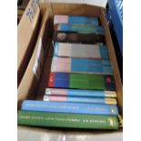 A small carton of books, selection of Harry Potter novels, mixed impressions.