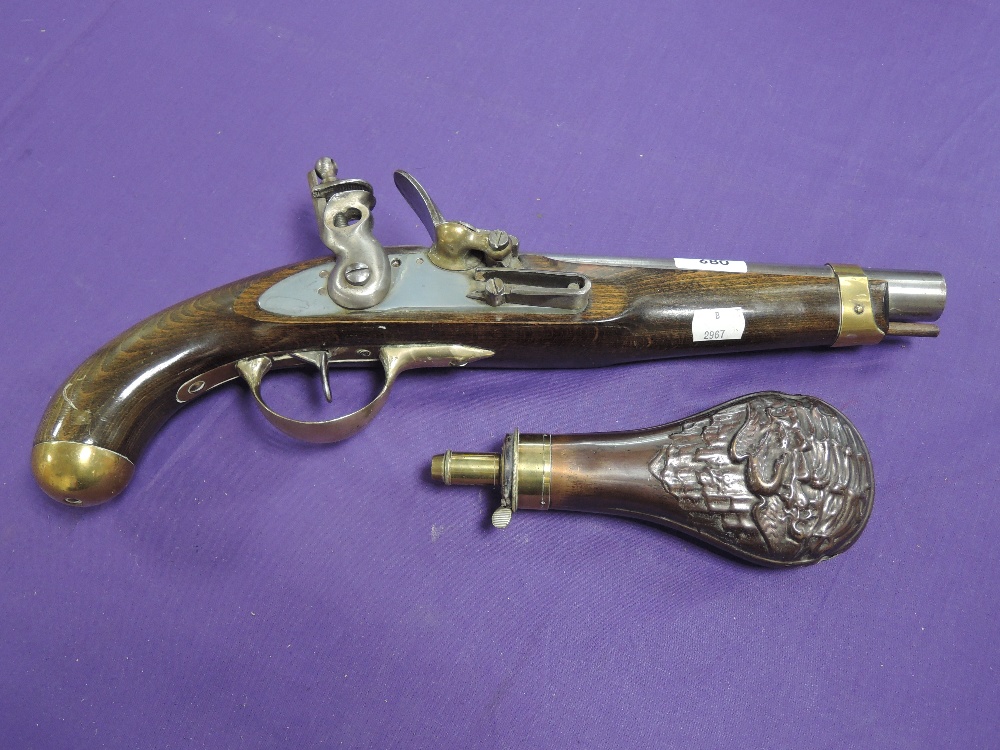 A very good replica flintlock pistol and an embossed copper powder flask by Bartram & Co