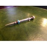 A Victorian yellow metal propelling pencil with amethyst terminal and turquoise inserts