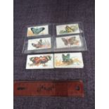 A set of fifty B.A.T. Cigarette cards, Butterflies girls design, 1928