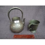 A 19th century Ryubund tea kettle having white and yellow metal naturalistic inlay decoration and