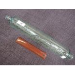 A traditional glass rolling pin having fern etched decoration