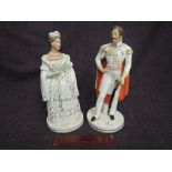 A pair of 19th century Staffordshire figures modelled as Queen Victoria and Prince Albert