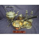 An Edwardian brass spirit kettle on stand, and similar period brassware including candle stand and