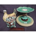 A 19th century Majolica bread platter, a similar hen lid (af) a Majolica lidded jar and a Majolica