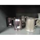 A selection of pewter tankards etc