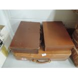 A selection of vintage leather bound suitcases