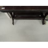 A vintage dark stained coffee table