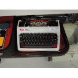 A vintage Daro Erika typewriter in case