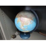 A vintage light up globe of the world