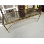 An early 20th Century heavy brass and glass coffee table