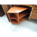 A vintage teak effect TV cabinet