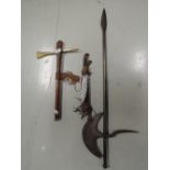 A selection of vintage tribal design weapons and iron axe