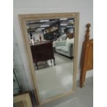 A stripped pine wall mirror