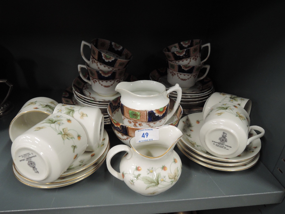 A selection of vintage tea cups and saucers including Doulton Strawberry cream