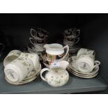 A selection of vintage tea cups and saucers including Doulton Strawberry cream