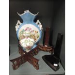 A selection of vintage ceramics and display stands including moon vase