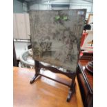 An early to mid 20th oak fire screen/table