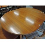 A vintage teak effect extending dining table