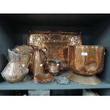 A selection of vintage copper wares including Arts and Crafts design tray, water jugs planter etc