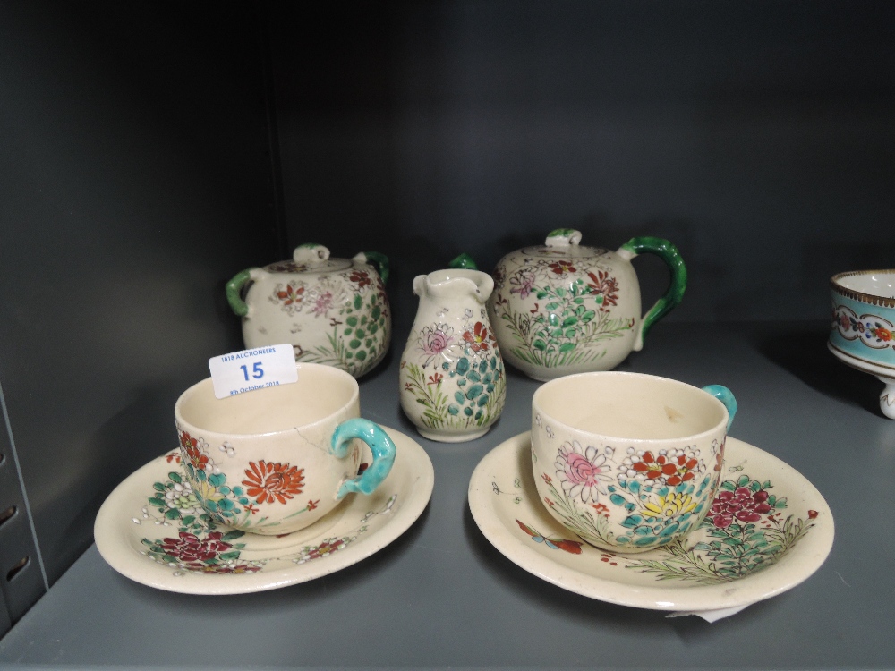 A vintage hand decorated oriental design part tea service