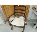 A mid 20th Century ladder back carver chair