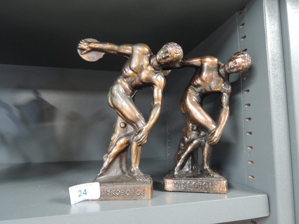 A pair of bronze effect greek discus throwers