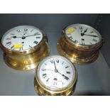 A selection of vintage wall mounted ship style clocks including Smith Astral