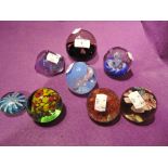 A selection of vintage glass paper weights including Caithness