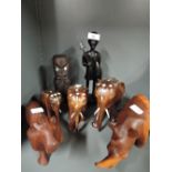 A selection of vintage African styled figures and figurines carved from hard woods