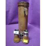 A set of vintage opera glasses and telescope case