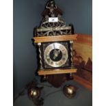 A vintage wall mounted clock treen and brass with Atlas figure holding globe