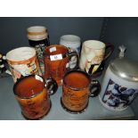 A selection of vintage ceramic tankards and mugs