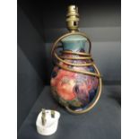 A modern Moorcroft table lamp having fruit and finches decoration, Sally Tuffin