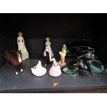 A selection of figurines and decorative ornaments including Royal Doulton, Poole and Beswick etc