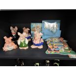 Six Wade Nat-West piggy banks with stoppers along with paperwork and cardboard clock