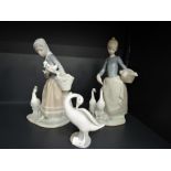 Two Lladro figurines, Girl feeding ducks & Girl with duck and ducklings (af) along with a Lladro