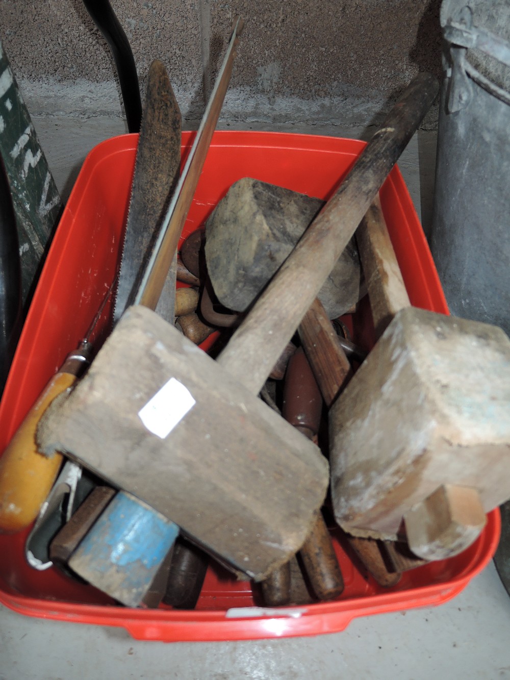 A selection of vintage woodworking tools including mallets