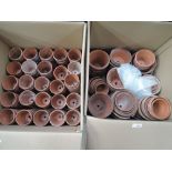 Two boxes of hand thrown terracotta plant pots
