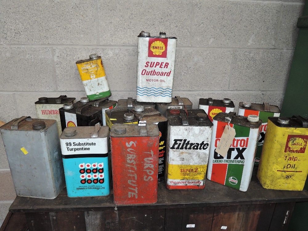 A selection of vintage fuel and oil cans including BP Castrol and Shell